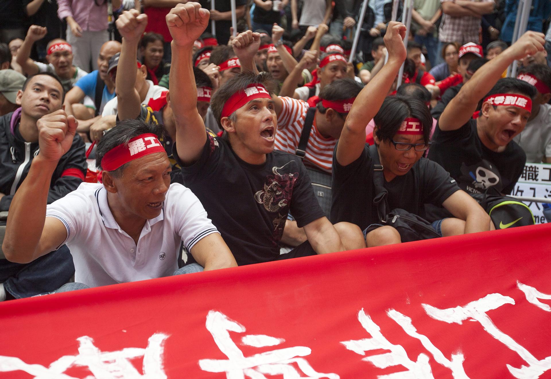 The striking dockers protest in Admiralty on May Day. Photo: EPA