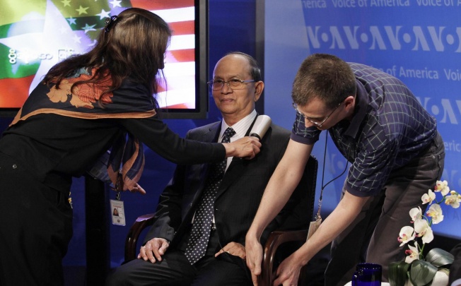 Staff help prepare President Thein Sein, of Myanmar, for a town hall event at the Voice of America in Washington. Photo: Reuters 