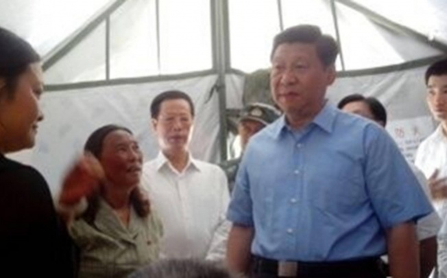 President Xi Jinping yesterday made a surprise visit to schools and temporary shelters in Yaan county, Sichuan. Photo: SCMP