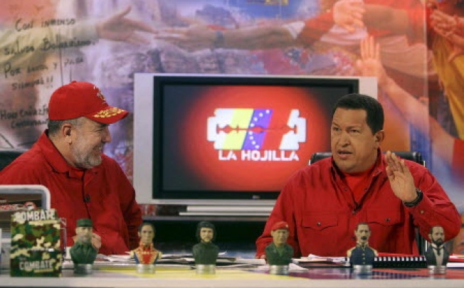 Venezuela's then President Hugo Chavez (right) appears on the television show with anchor Mario Silva in 2007. 