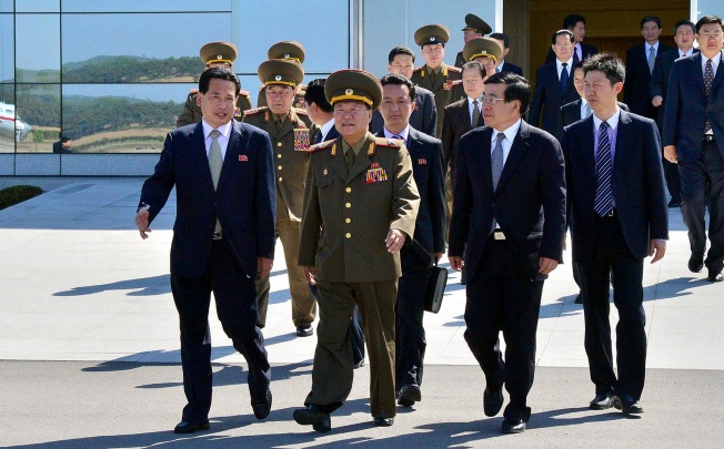 Choe Ryong-Hae (centre), director of the Korean People's Army politburo, leaving Pyongyang airport to visit China as a special envoy of North Korean leader Kim Jong Un. Photo: AFP