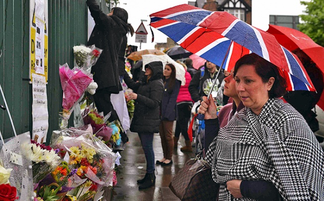 Floral tributes for Drummer Lee Rigby at the scene of his killing in Woolwich. Photo: Reuters