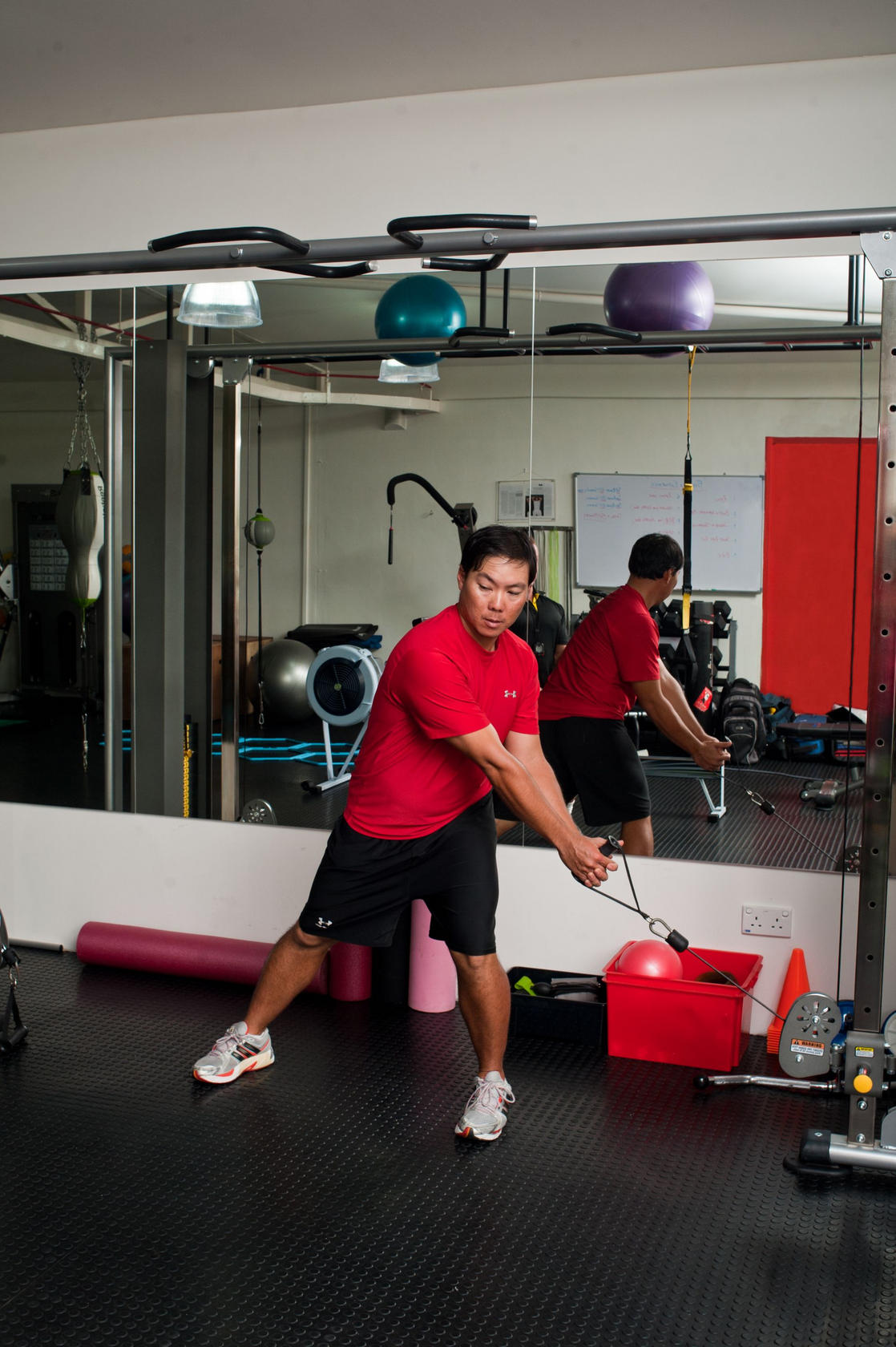 Using the cable machine, start pulling from a low angle.