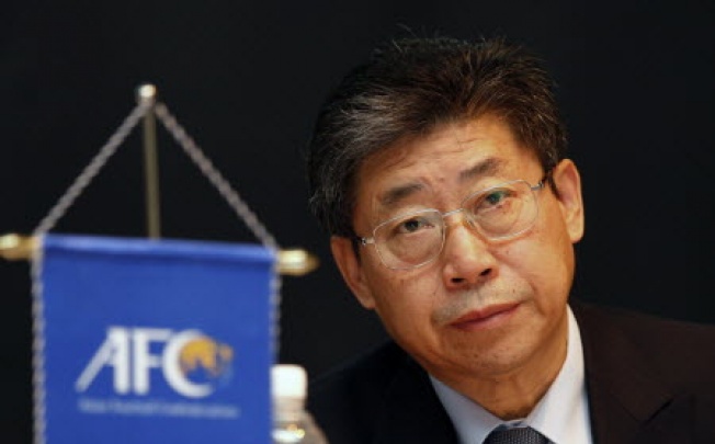 Asian Football Confederation Acting President Zhang Jilong listens to a reporter's questions during an Interpol conference to discuss match-fixing, in Kuala Lumpur, Malaysia. Photo: AP