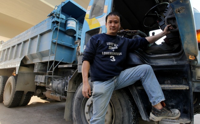 Lau Wai-kei, driver and owner of dump truck says the government should not introduce a blanket policy on phasing out old and polluting commercial diesel truck. Photo: Edward Wong