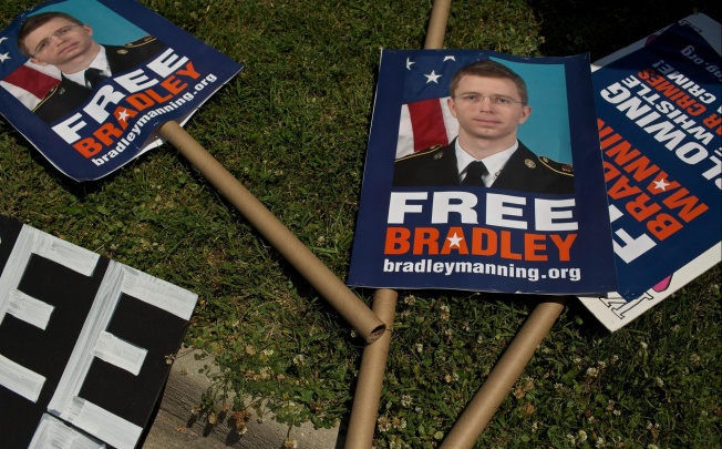 Signs supporting Bradley manning lie on the ground after hundreds of his backers marched in Fort Meade, Maryland, at the weekend. Photo: AFP