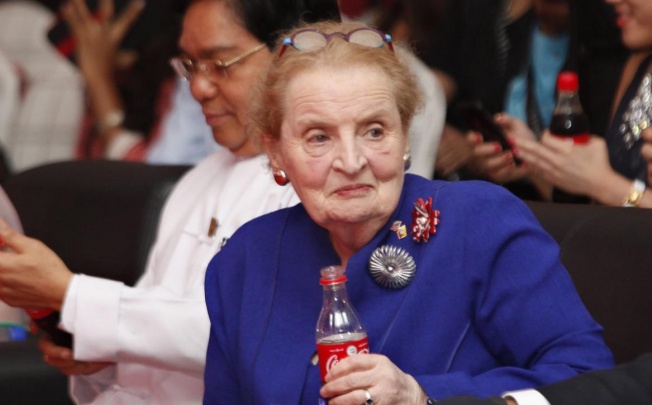 Madeleine Albright holds a Coke during the ceremony. Photo: EPA