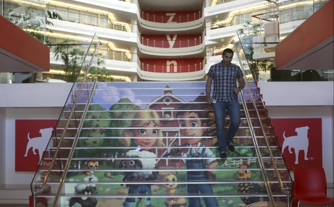 Player avatars from Zynga's FarmVille 2 are seen on a stairway at the entrance to Zynga headquarters in San Francisco. Photo: Reuters