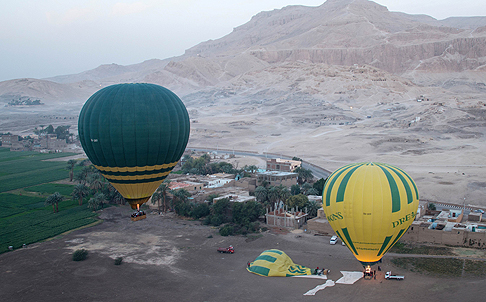 The hot air balloon (left) that later crashed is seen taking off from Luxor in February. Photo: AFP