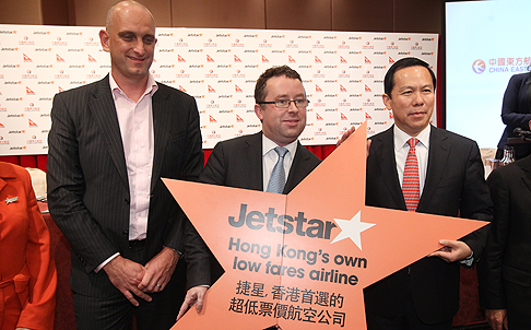(From left) Jetstar chief executive Bruce Buchanan, Qantas chief executive Alan Joyce and China Eastern Airlines chairman Liu Shaoyong. Photo: Sam Tsang