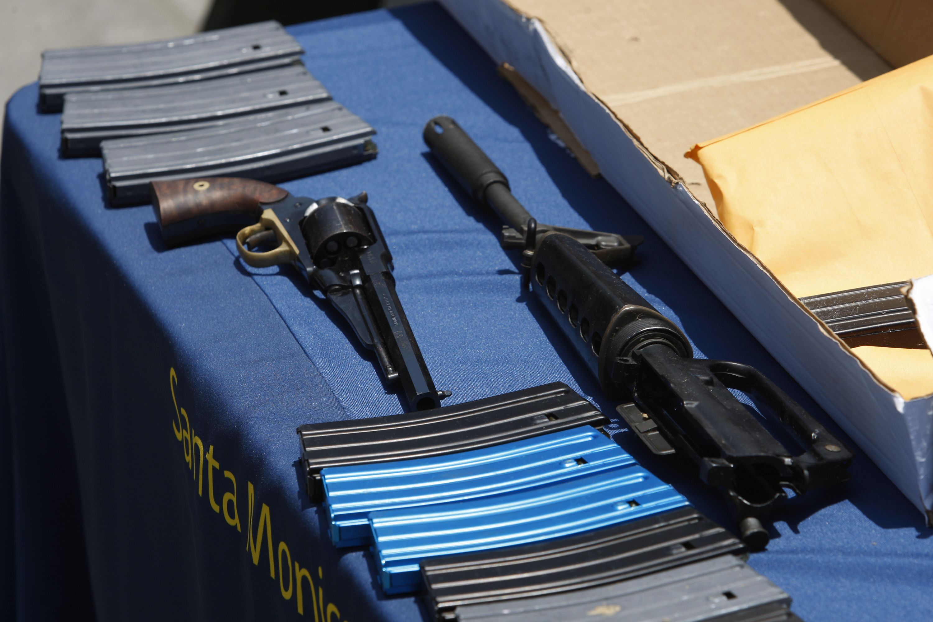 A .44 revolver, part of an AR-15 type assault rifle and ammunition allegedly dropped by the gunman during a mass shooting spree in Santa Monica, California. Photo: AFP