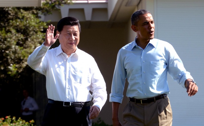 Chinese President Xi Jinping (left) and U.S. President Barack Obama take a walk before heading into their second meeting, at the Annenberg Retreat, California. Photo: Xinhua