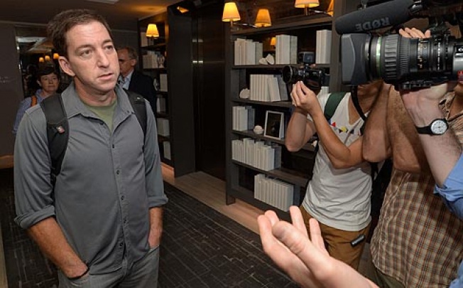 Guardian reporter Glenn Greenwald who interviewed NSA whistleblower Edward Snowden talks to reporters at the W Hotel in Kowloon on Monday. Photo: Felix Wong