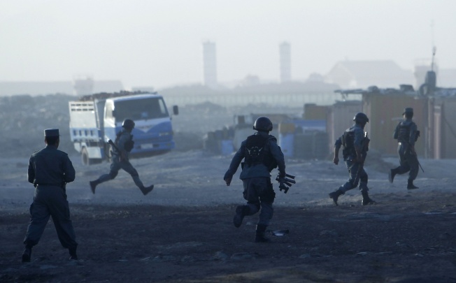Afghan police arrive at the site of an attack in Kabul. Photo: Reuters