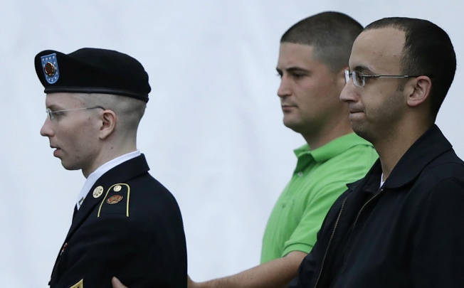 Bradley Manning is taken from the courtroom after day four of his court martial in Fort Meade, Maryland, on Tuesday. Photo: Reuters