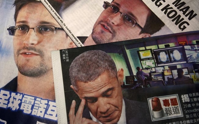 Photos of US whistleblower Edward Snowden and President Obama are printed on the front pages of local English and Chinese newspapers in Hong Kong. Photo: Reuters