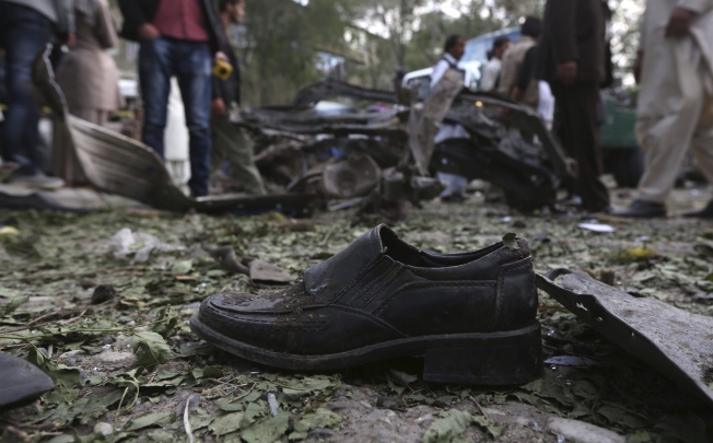 A shoe of a civilian is seen at the site of a suicide car bomb attack in Kabul. Photo: Reuters