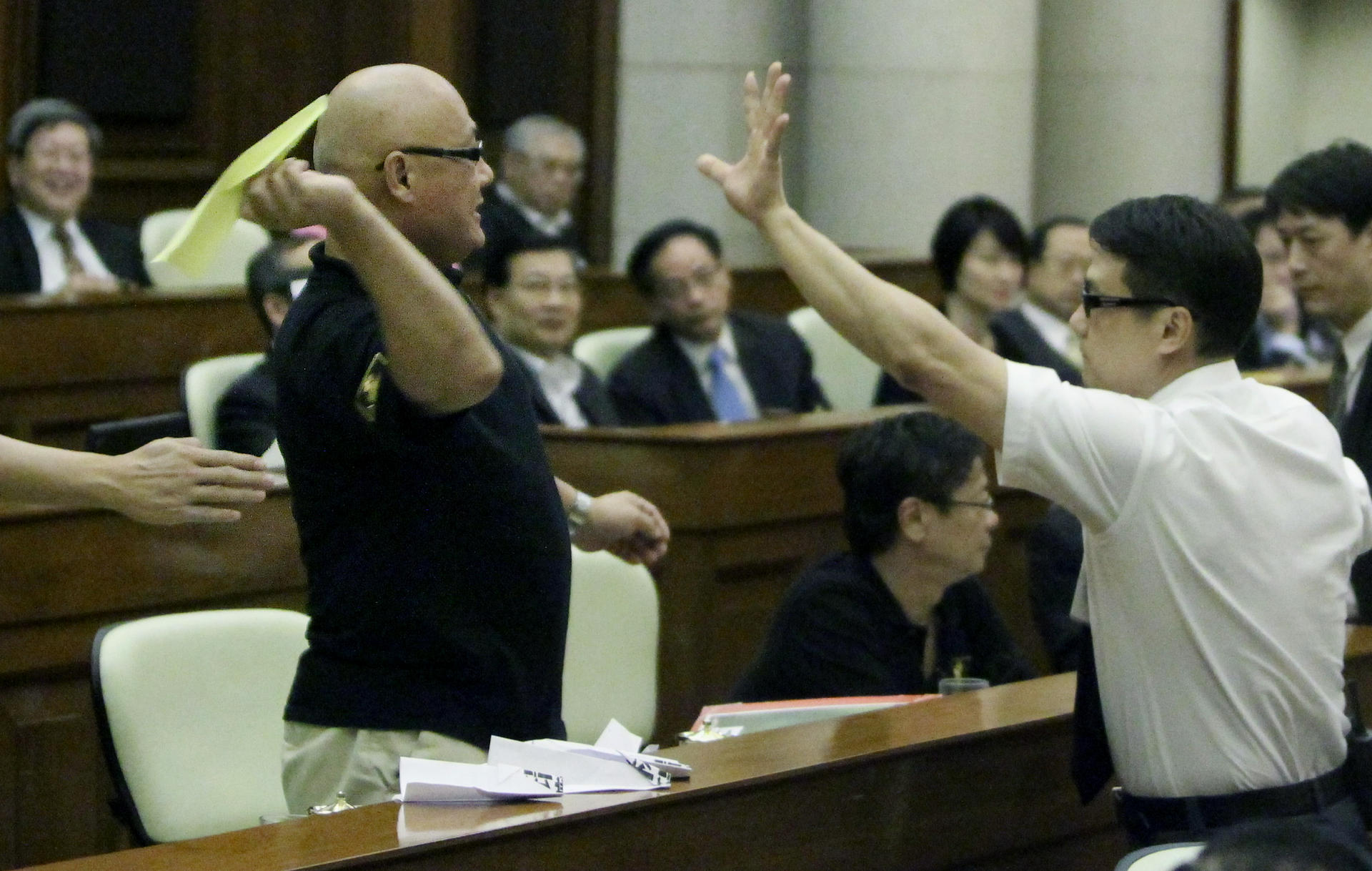 Lawmaker Albert Chan Wai-yip throws a paper plane at the then chief executive Donald Tsang in 2011. Legco members owe the chief executive no loyalty. Photo: Felix Wong