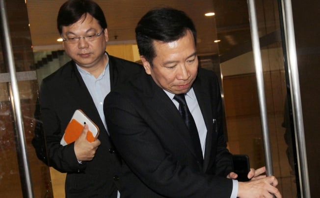 Peter Chan, followed by Pastor Lam Yee-lok, leaves court yesterday. Lee christened Chan in March. Photo: Edward Wong
