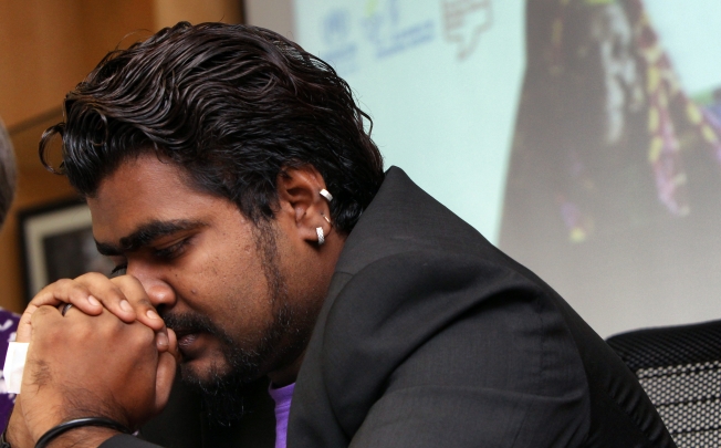 Siva, a refugee, shares his experiences in Hong Kong at a press conference ahead of World Refugee Day by UNHCR and other NGOs at Central. Photo: David Wong