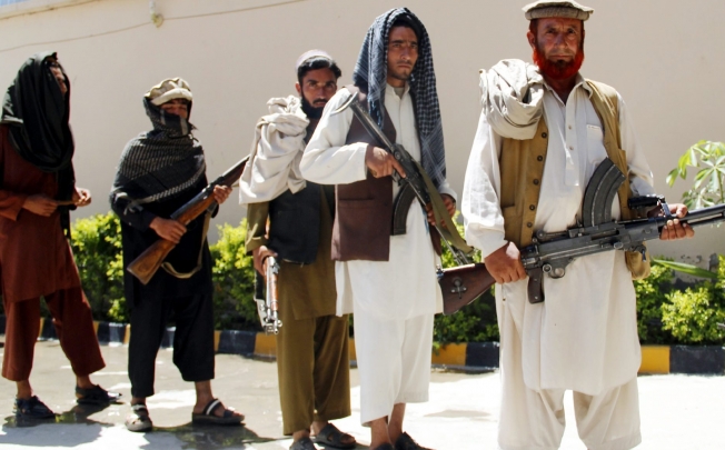 Former Taliban militants attend an amnesty programme in Jalalabad, Afghanistan. The Taliban claimed responsibility on Wednesday for an attack in Afghanistan which killed four American troops. Photo: EPA