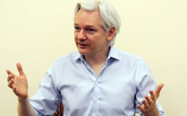 Wikileaks founder Julian Assange speaks to the media inside the Ecuadorian Embassy in London on June 14, 2013. Photo: AFP