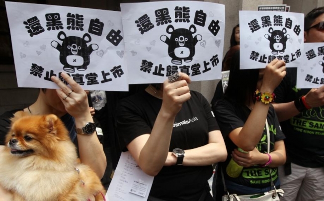 Protesters went on a march in April to demand banning bear bile imports to Hong Kong and save the moon bear. Photo: Sam Tsang
