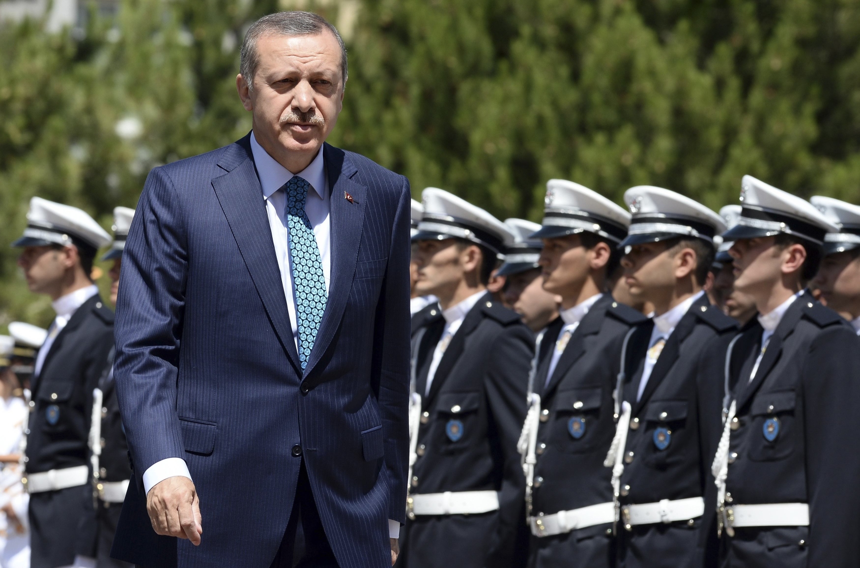 Turkey's Prime Minister Tayyip Erdogan (left). Turkish police have raided homes in the capital, Ankara, detaining people involved in protests against Erdogan's government. Photo: Reuters