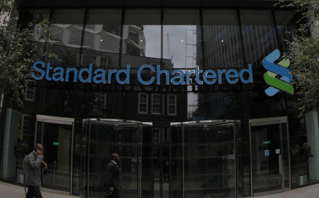 Standard Chartered said income for the first half was expected to grow in the mid-single digits year-on-year. Photo: AP