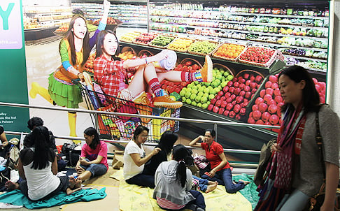 Domestic workers on a day off in Central. Photo: Felix Wong