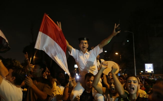 An Egyptian policeman celebrates in Cairo. Photo: Xinhua