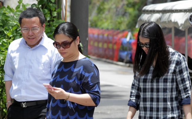 Tam Miu-ching (centre), wife of Peter Chan, and his daughter Polly Lon Pui-chun (right) leave Stanley Prison. Photo: SCMP