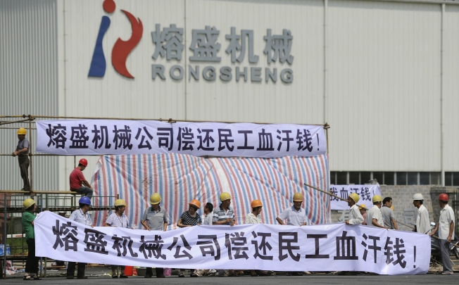 Rongsheng workers demonstrate in a protest calling for overdue salaries on Monday. Photo: Reuters