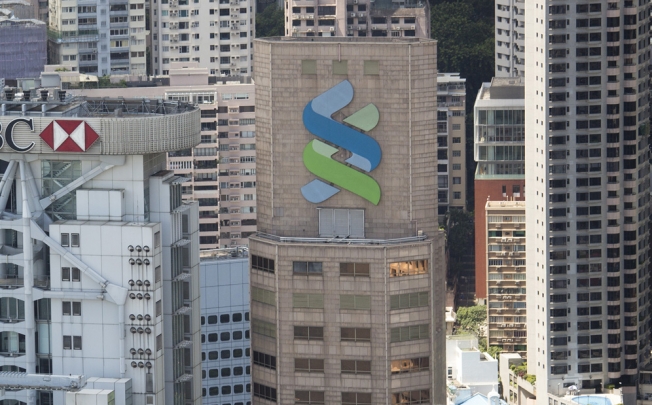 Standard Chartered makes more effort to understand shopper's needs, but yet again life insurance is offered. Photo: Bloomberg