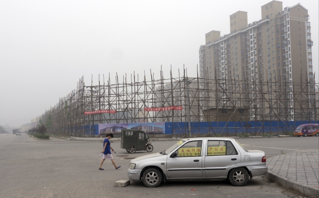 While China is world's largest construction market and cities expand rapidly, the supply of social housing could become a major problem. Photo: EPA