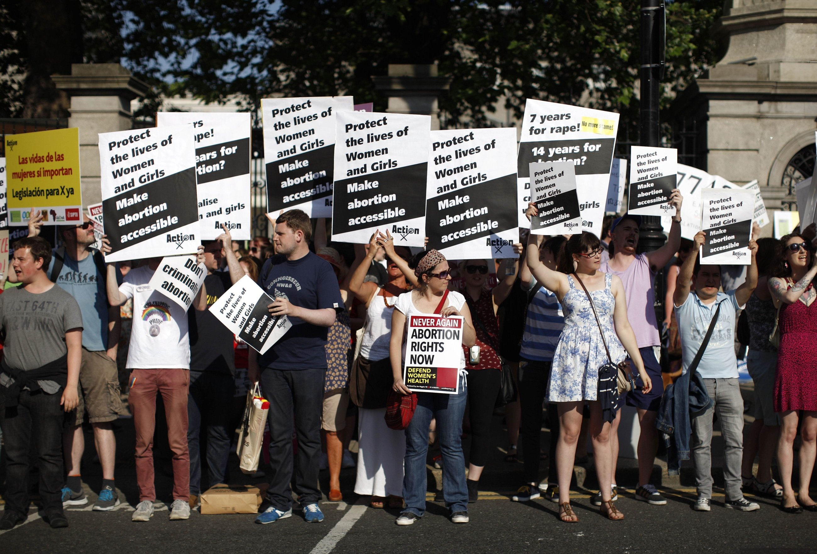 Pro-Choice supporters hold placards in front of the gates of the Irish Parliament building in Dublin. Photo: AFP