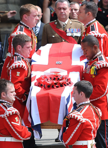 Soldiers carry Lee Rigby's coffin from the church. Photo: EPA