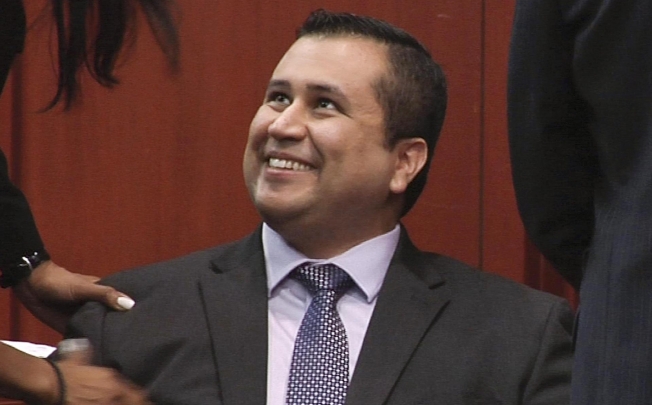 George Zimmerman smiles after hearing the verdict. Photo: AP