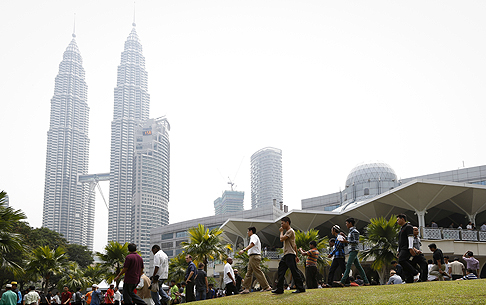 Muslims leave a mosque after prayers last Friday below a hazy sky in Kuala Lumpur, Malaysia. Photo: AP