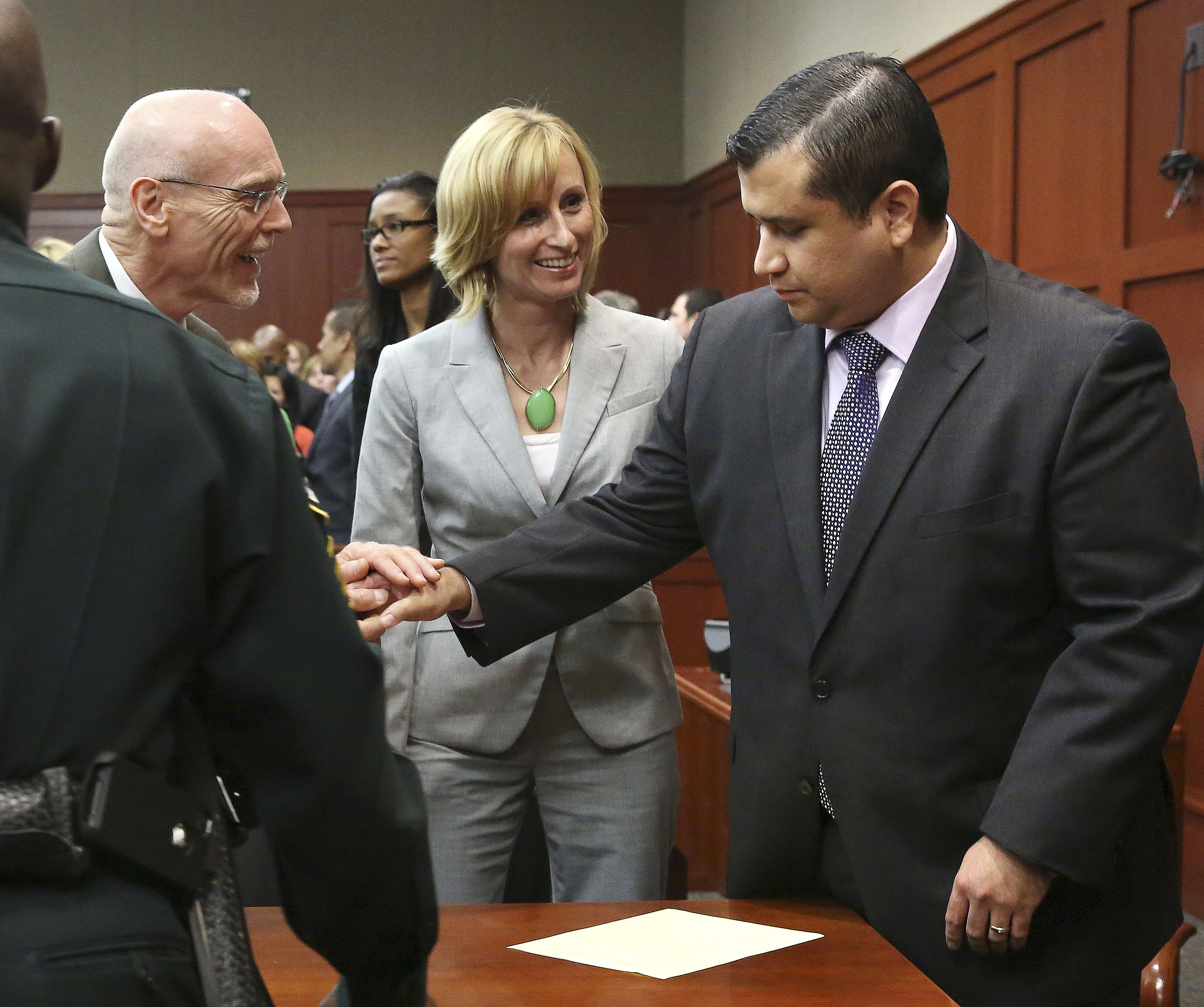 George Zimmerman, right, is congratulated by his defence team after being found not guilty. Photo: AP