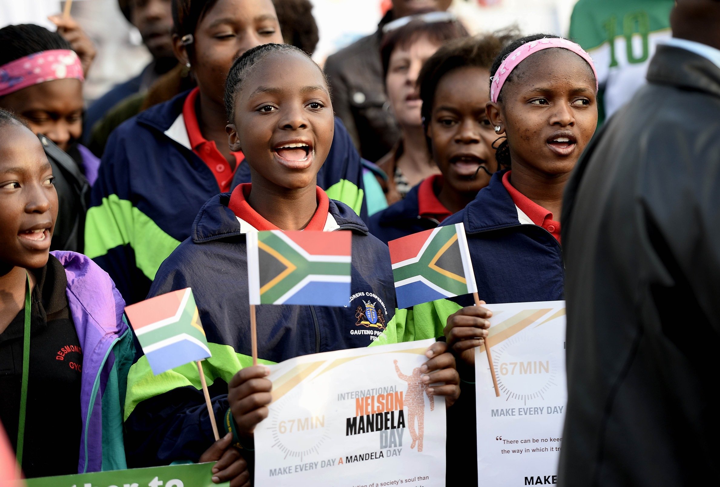 Schoolchildren sing "Happy Birthday" to former South African President Nelson Mandela on Thursday outside the Medi Clinic Heart Hospital in Pretoria. Photo: AFP