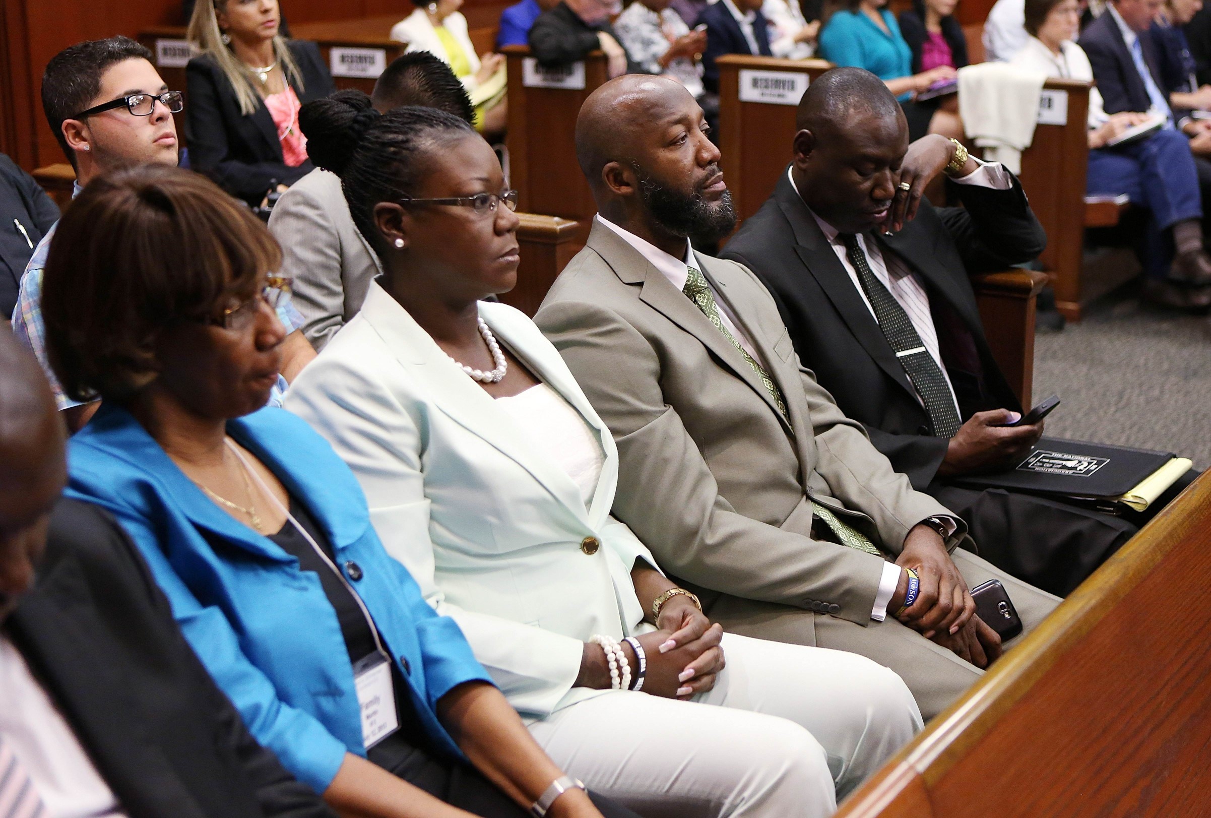 Sybrina Fulton (2nd left) and Tracy Martin (3rd left), Trayvon Martin's parents, and family lawyer Benjamin Crump (4th left) sit in court during George Zimmerman's murder trial. Photo: AFP