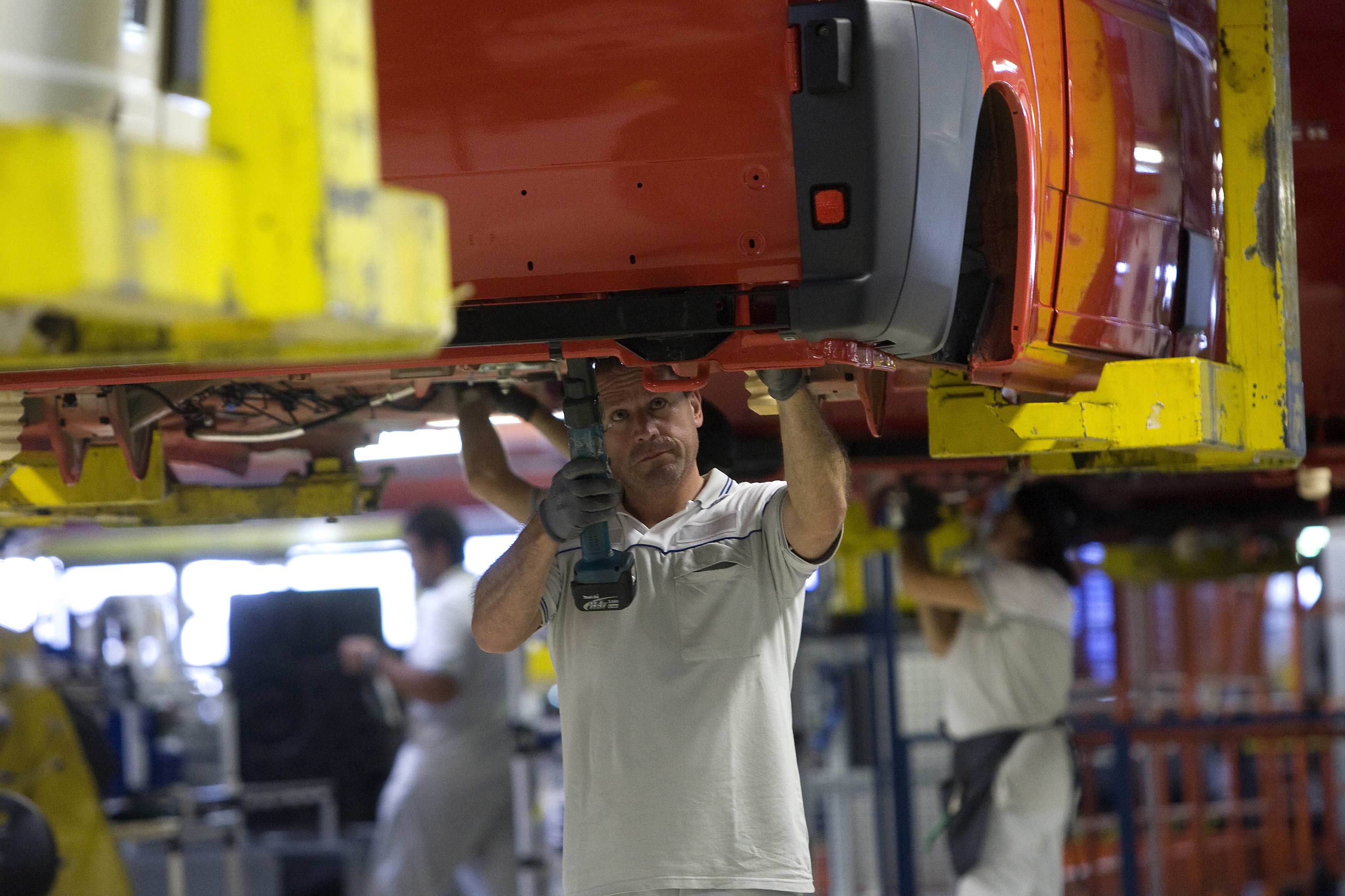 Workers at Fiat's Sevelsud plant in Atessa in central Italy. Fiat said on Tuesday it would freeze investments in new models until there is clarity over the impact of a court ruling that cast doubt on its labour relations. Photo: Reuters