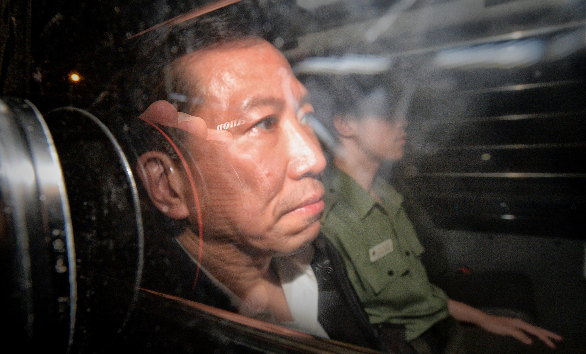 Peter Chan being escorted from court. Photo: SCMP 