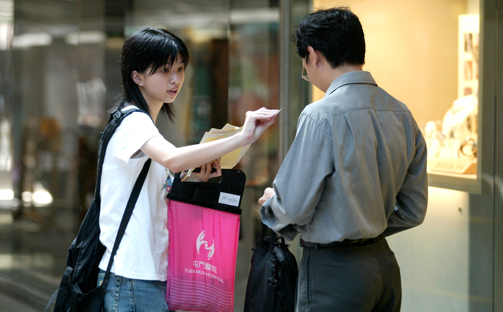 Every Saturday, passers-by can be seen dropping a coin or note into a flag-seller's sealed bag.