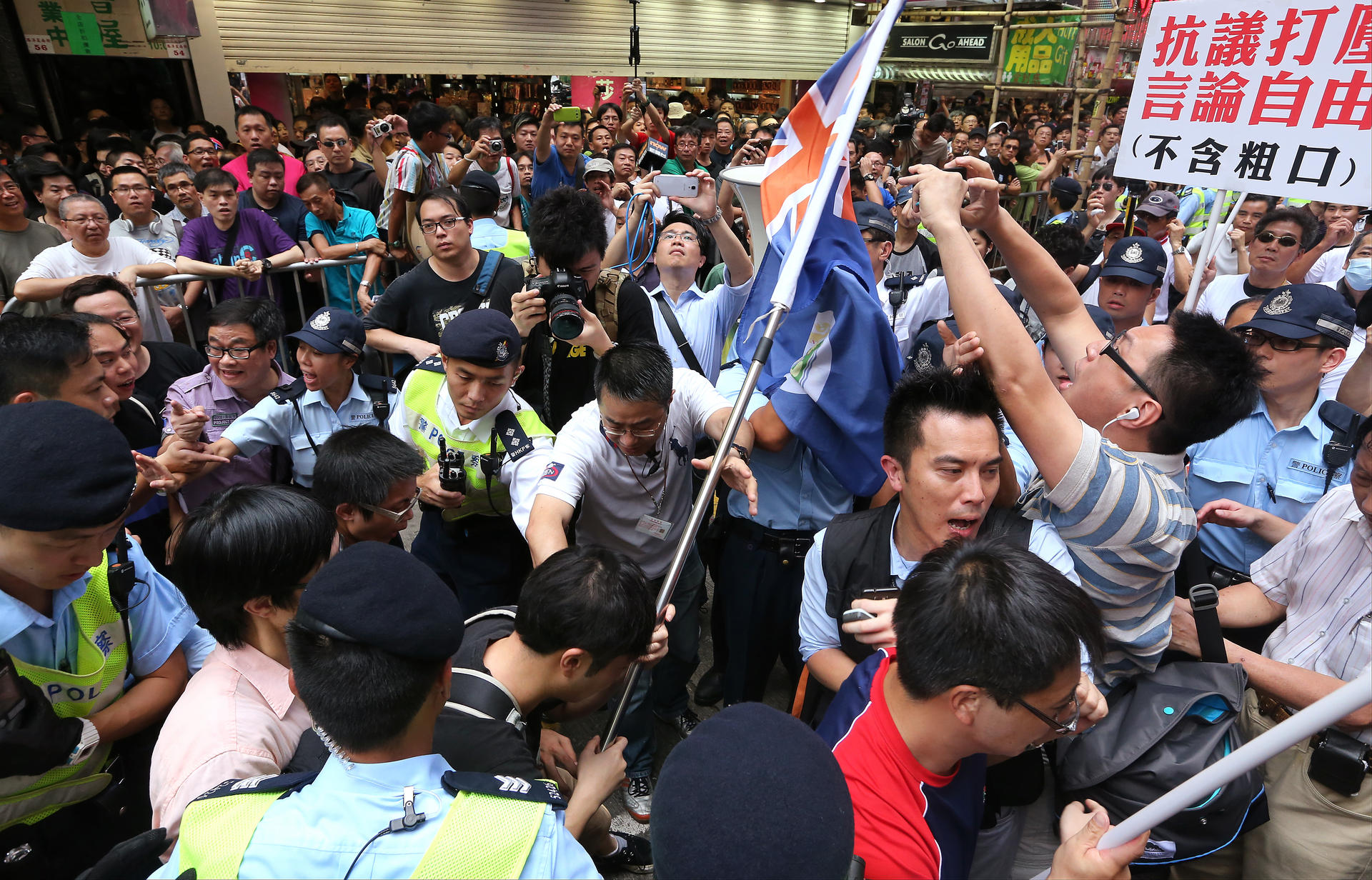 Opposing sides scuffle in Mong Kok on Sunday. Photo: Felix Wong