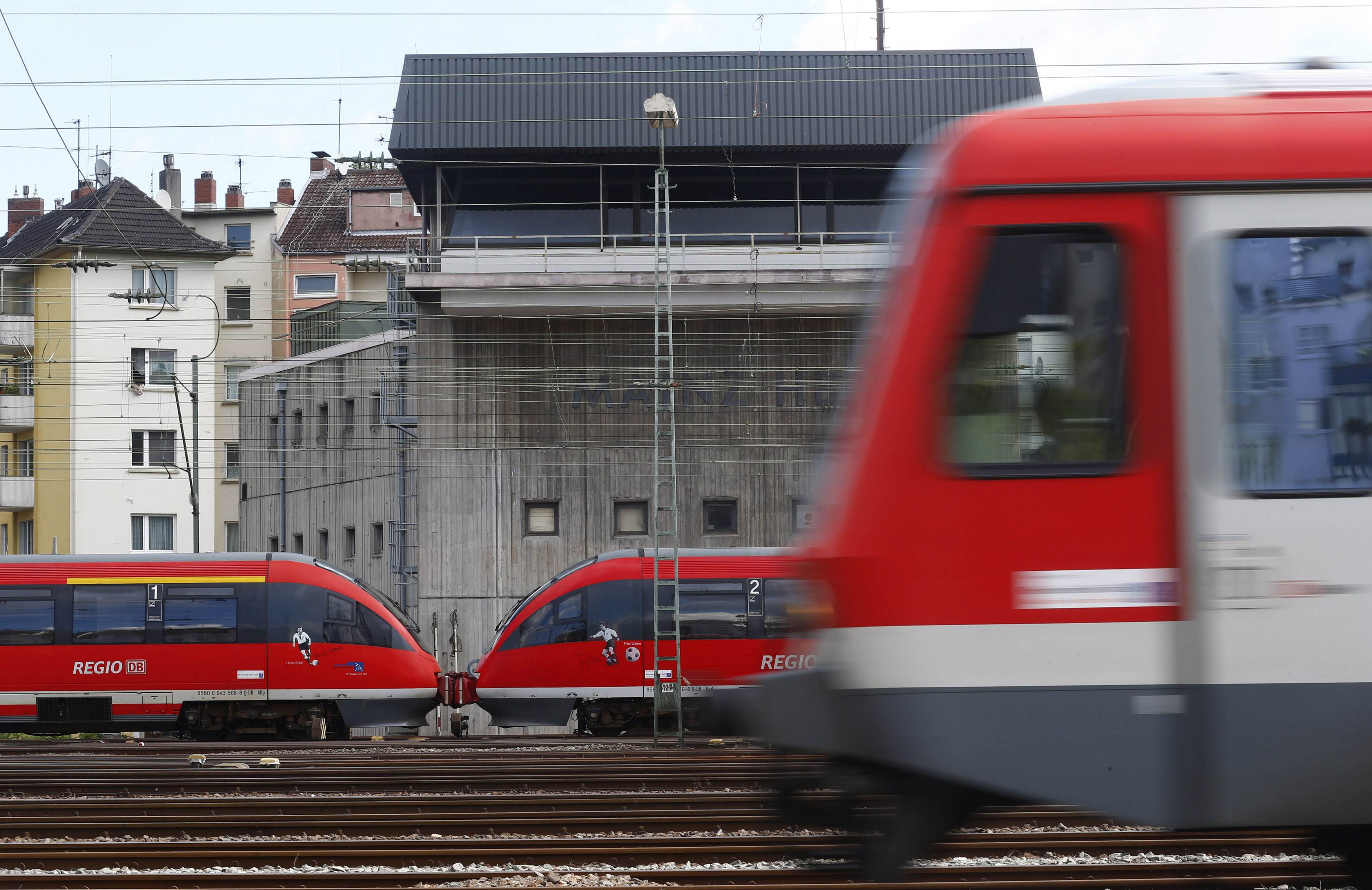 Trains drive past the signal tower of the Deutsche Bahn. Photo: Reuters