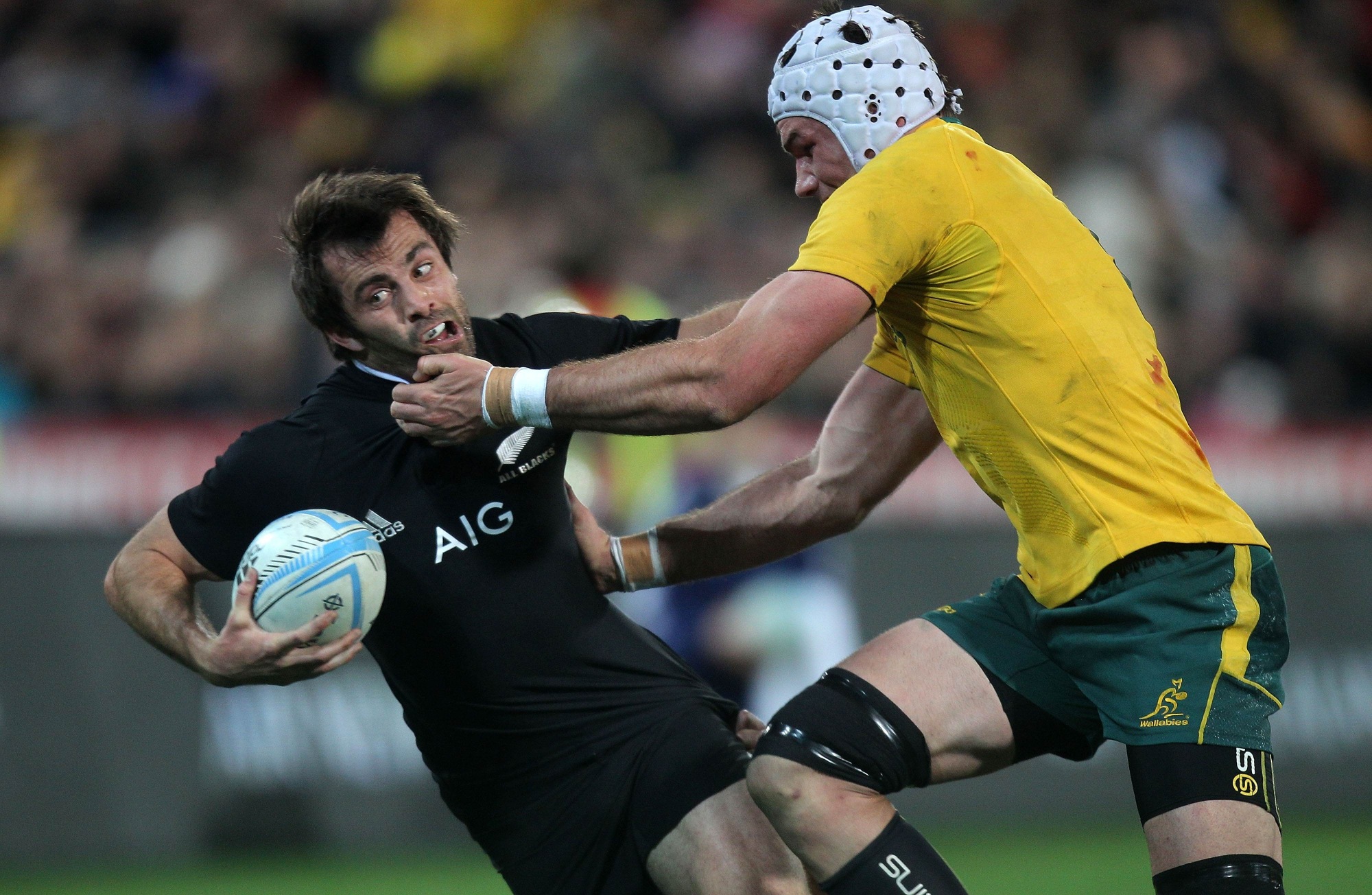 Conrad Smith (L) of New Zealand is tackled by Ben Mowen of Australia during the 2nd Bledisloe Cup game rugby union match between the New Zealand All Blacks and Australia at the Westpac Stadium in Wellington on Saturday. Photo: AFP