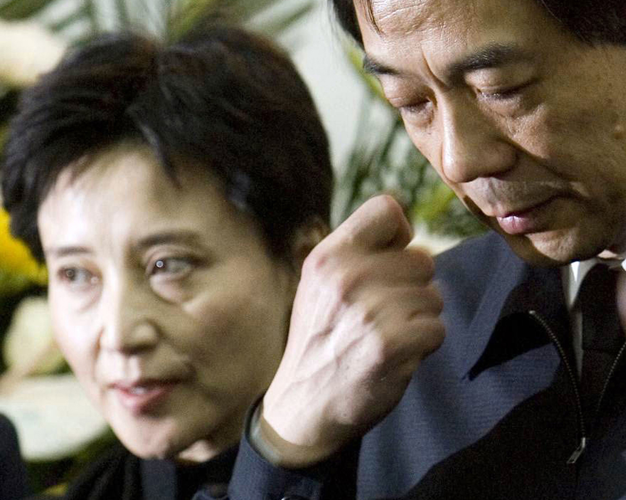 Gu Kailai and Bo Xilai seen at a memorial ceremony for Bo's father Bo Yibo in Beijing, Jan. 17, 2007. Photo: AP