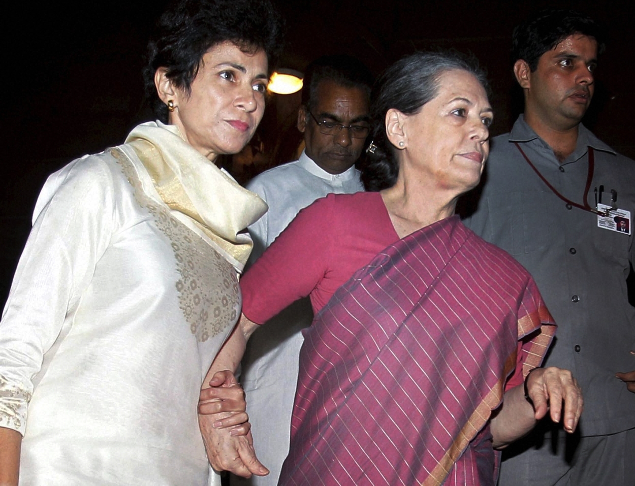 Indian Social Justice minister Kumari Selja (left) escorts chairwoman of ruling United Progressive Alliance and Congress party president Sonia Gandhi, who has fallen ill.